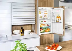 Open refrigerator in the kitchen photo