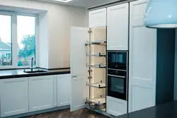 Cabinet above the refrigerator in the kitchen photo