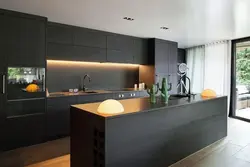 Gray kitchen with black handles photo