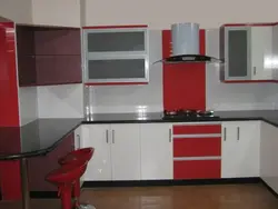 White kitchens with red countertops photo