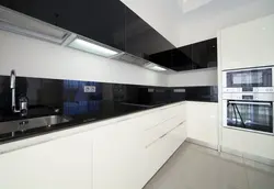 White kitchen with black apron photo