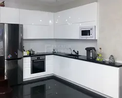 White Kitchen With Black Apron Photo