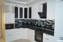White kitchen with black apron photo