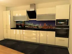 Black appliances in a beige kitchen photo