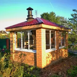 Gazebo with kitchen and barbecue photo
