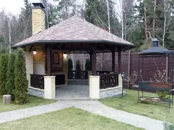 Gazebo with kitchen and barbecue photo