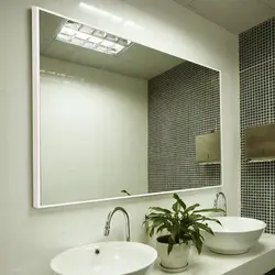 Photo of a mirror above the bathroom sink