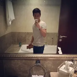 Photo of a man in the bathroom mirror