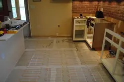 Warm floor tiles in the kitchen photo