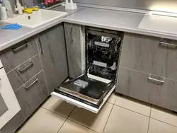 Dishwasher in the kitchen under the countertop photo