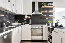 White kitchen with dark gray countertop photo