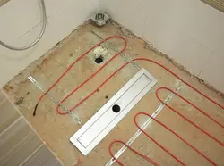 Heated floor in the bathroom under tiles photo