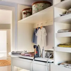 Space for an ironing board in the dressing room photo