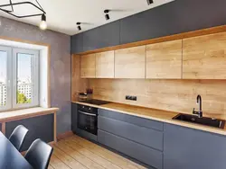 Marble apron and wooden countertop in the kitchen photo