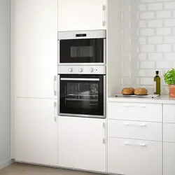 Pencil case with oven and microwave in the kitchen photo