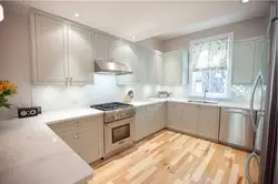 Cream kitchen with wooden countertop and apron photo