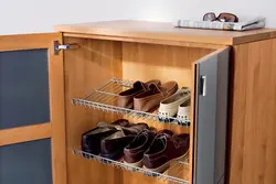 Wardrobe in the hallway with shelves for shoes photo