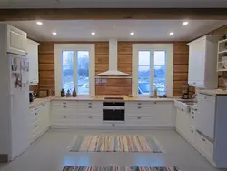 Corner kitchens in a wooden house with a window photo