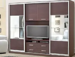 Wall cabinet in the living room with space for a TV photo