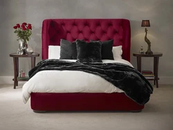 Burgundy bed in the bedroom interior