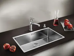 Stainless steel sink in the kitchen interior