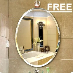 Овальное зеркало в интерьере ванной