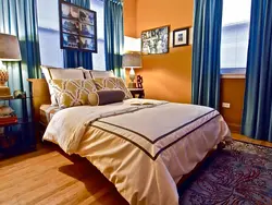 Orange bed in the bedroom interior