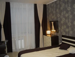 Chocolate curtains in the bedroom interior