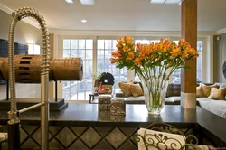 Vase with flowers in the kitchen interior