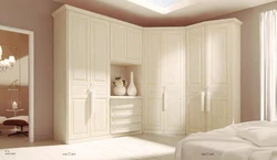 White corner wardrobe in the bedroom interior