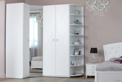 White corner wardrobe in the bedroom interior