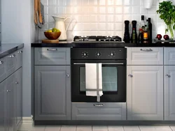 Gray kitchen with black handles in the interior