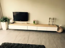 White TV stand in the living room interior