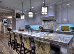 Gray kitchen in the interior with marble countertops