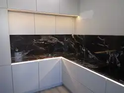 Black Marquina marble countertop in the kitchen interior