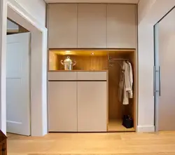 Wardrobe design with a mezzanine in the hallway