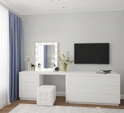 Bedroom design with chest of drawers and table