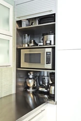 Kitchen design with microwave cabinet