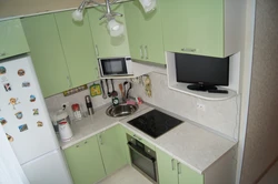 Small kitchen design with microwave and refrigerator