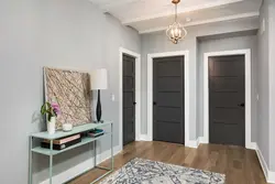 Doors In The Interior Of An Apartment With Gray Floors