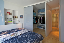 Narrow bedroom design with dressing room