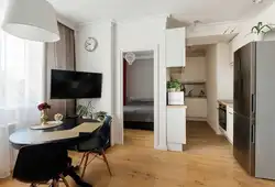 Design of a one-room apartment with a kitchen in a niche