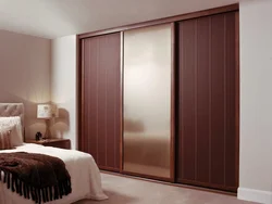 Bedroom wardrobe design in a modern style without mirrors