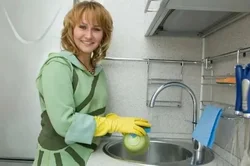 Washing dishes in the kitchen photo