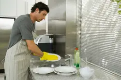 Washing Dishes In The Kitchen Photo