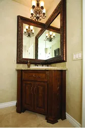 Photo of a bathtub with a corner mirror