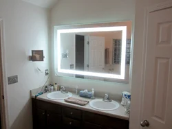 Mirror in a small bathroom photo