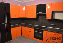 Orange kitchen black countertop photo