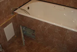 Acrylic bathtub in tiles photo