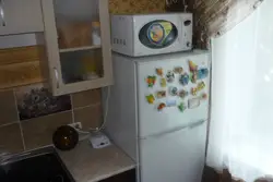 Photo of refrigerator and microwave in the kitchen